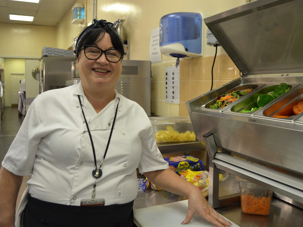 Catering line manager at sandwich making station
