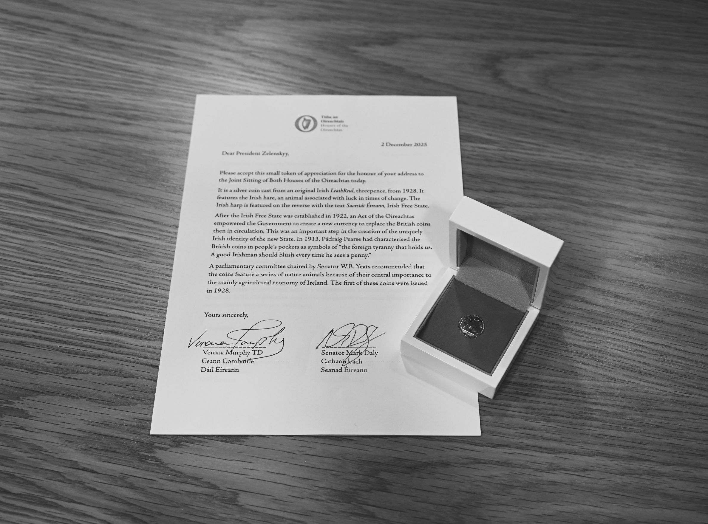 Coin presented to President Zelenskyy on the occasion of a state visit, in a case along with a letter